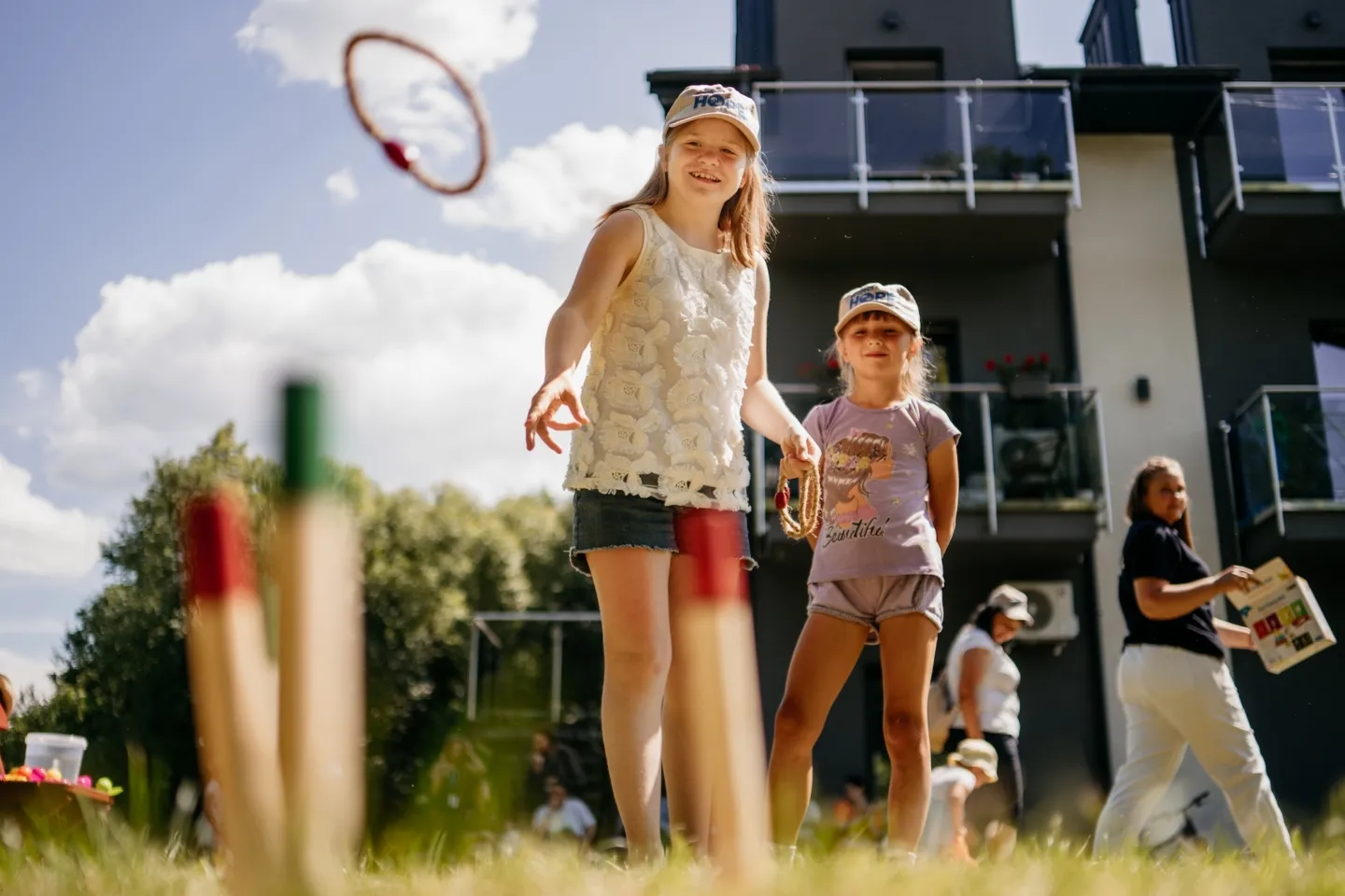 young girls playing a lawn game