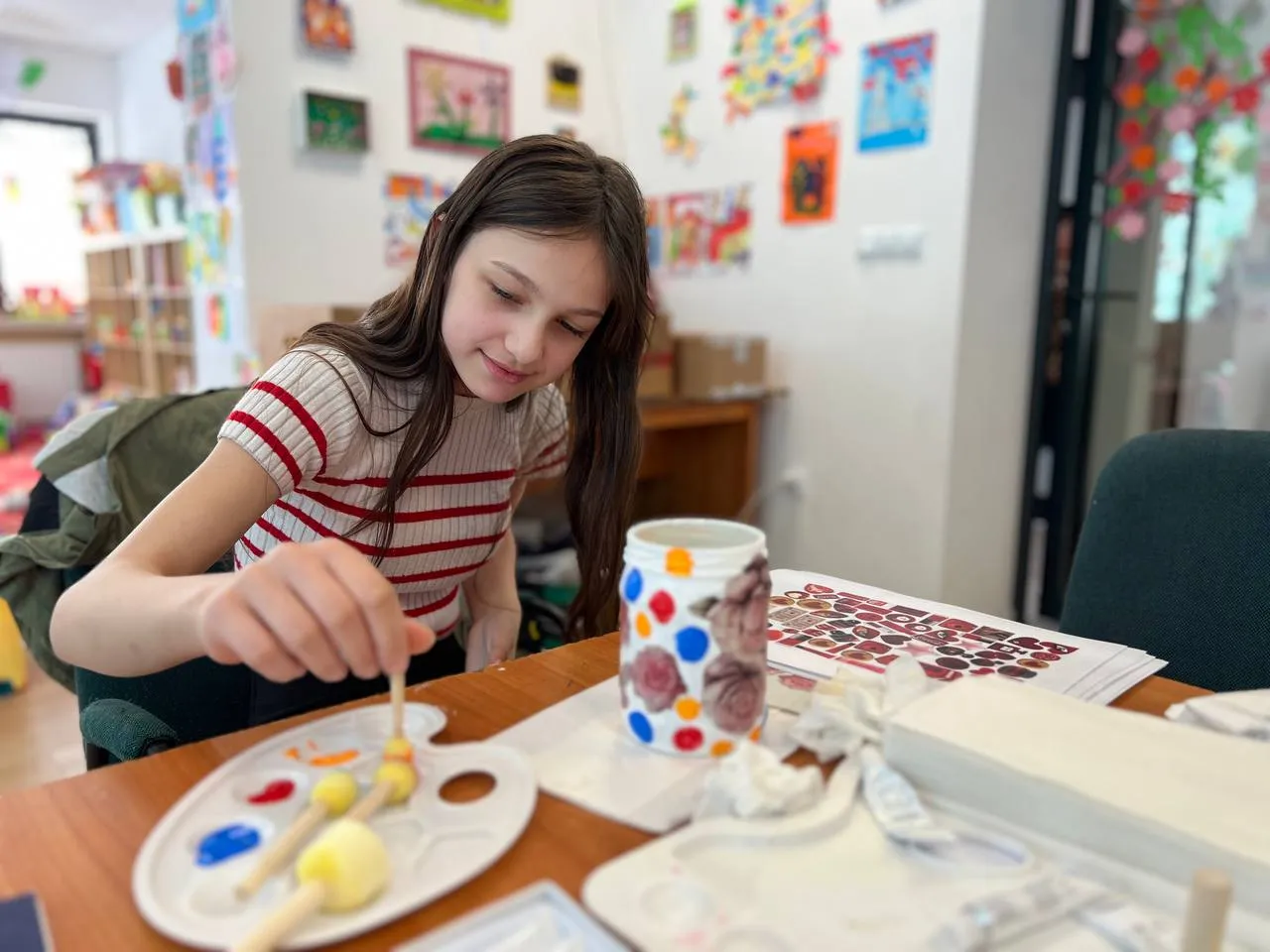 young girl paints