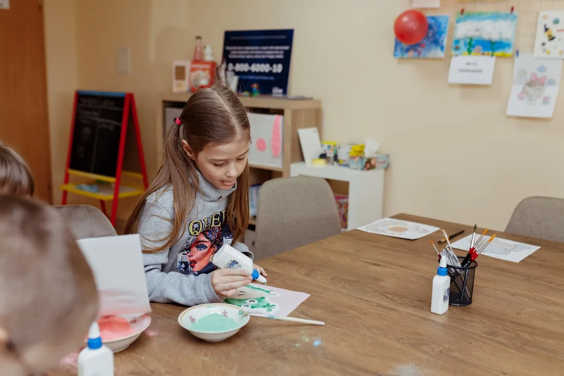 young girl paints
